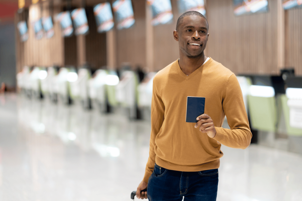 man with passport at airport